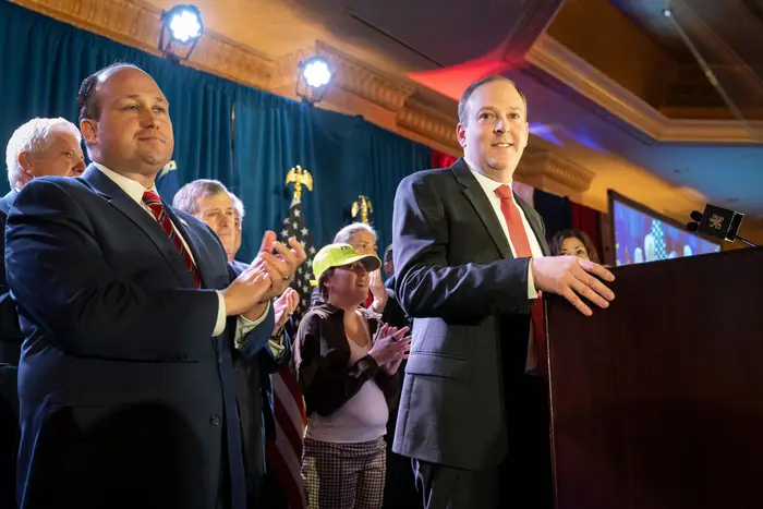 Rep. Lee Zeldin, right, smiles before speaking to delegates and assembled party officials at the 2022 NYGOP Convention, in Garden City, N.Y. Republicans from across New York met Tuesday to choose their gubernatorial nominee to run against Gov. Kathy Hochul in November.